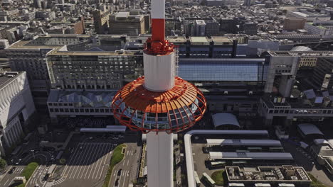 kyoto japan aerial v81 panoramic birds eye view drone fly around the landmark tower capturing major railway station and views of downtown shimogyo ward - shot with mavic 3 pro cine - oct 8th 2023
