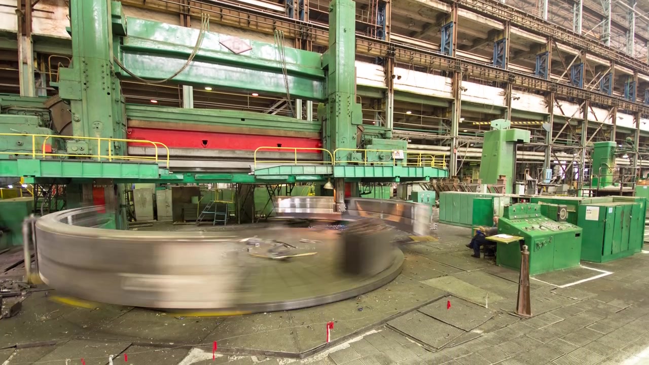 Industrial production of turbines for heavy industry timelapse. Huge steel turbine components processing. Industrial. Manufacture of water turbines. The huge machine turbine production. Large parts of the plant