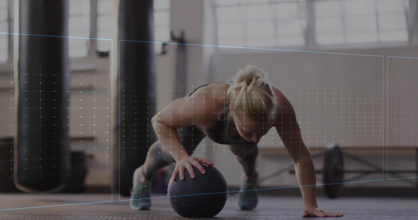 Mid adult woman performing medicine ball pushups in gym rising pulse waveform driving fitness gains