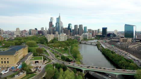 drone aerial pan left of philadelphia city skyline showing comcast technology center and the art museum