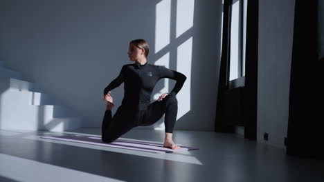 woman doing yoga in a studio