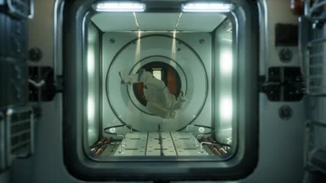 astronaut inside the orbital space station