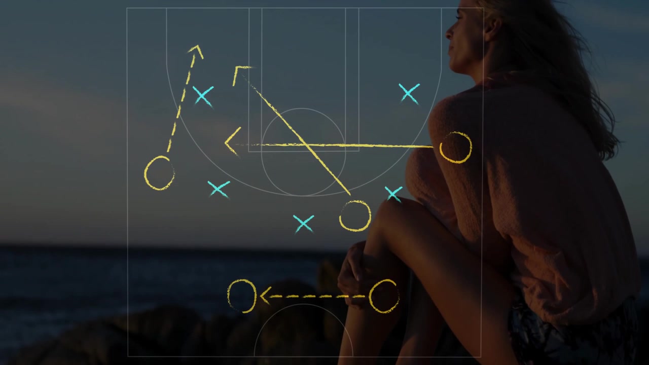 Woman sitting rocky shore, showing educational basketball court overlay through dusk sea background
