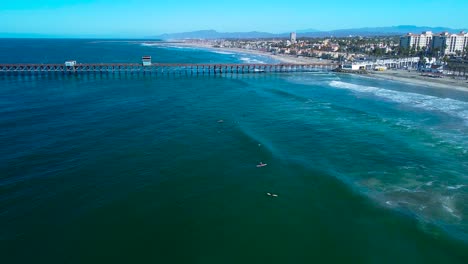 oceanside drone, pier, fly by. long shot