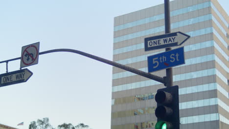 Traffic-lights-road-signs-hanging-over-street.-Traffic-regulation-in-city.