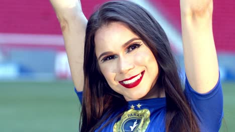 beautiful brazliian girl laughs and raises arms, slow motion