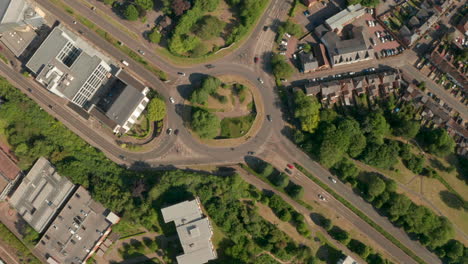 Pan-down-aerial-shot-over-roundabout-with-separated-pedestrian-access-underneath