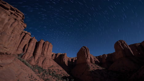 star trails over red rock canyon at night