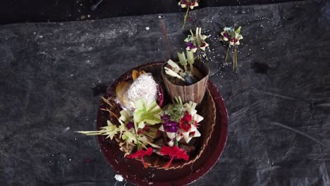 Balinese-Hinduism-Religious-Offerings-with-Flowers-and-Sage-Displayed-for-Praying-Ceremony,-Canang-Sari,-Nyepi-Day-of-Silence