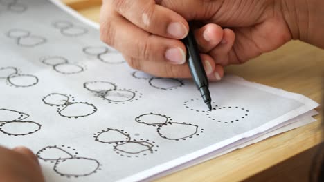 person practicing number recognition