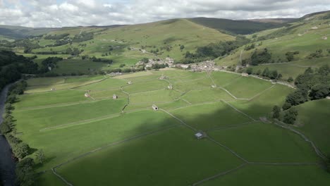 an aerial view of the yorkshire village of gunnerside and the surrounding yorkshire dales on a sunny summer day, england, uk