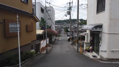 establishing shot of a japanese city street, local neighborhood in summer japan