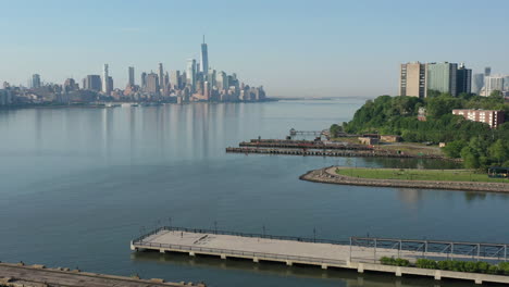 a drone view of a calm hudson river from the nj side early on a sunny morning