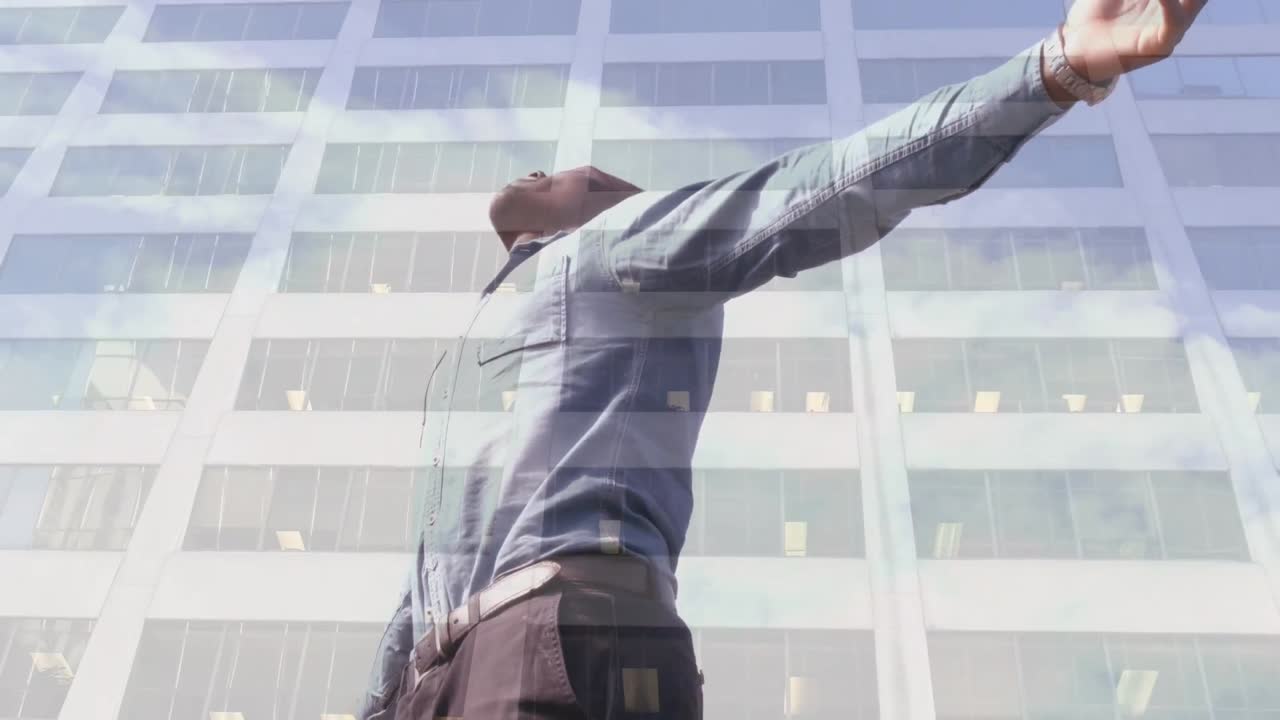 Animation of african american man with arms outstretched over cityscape