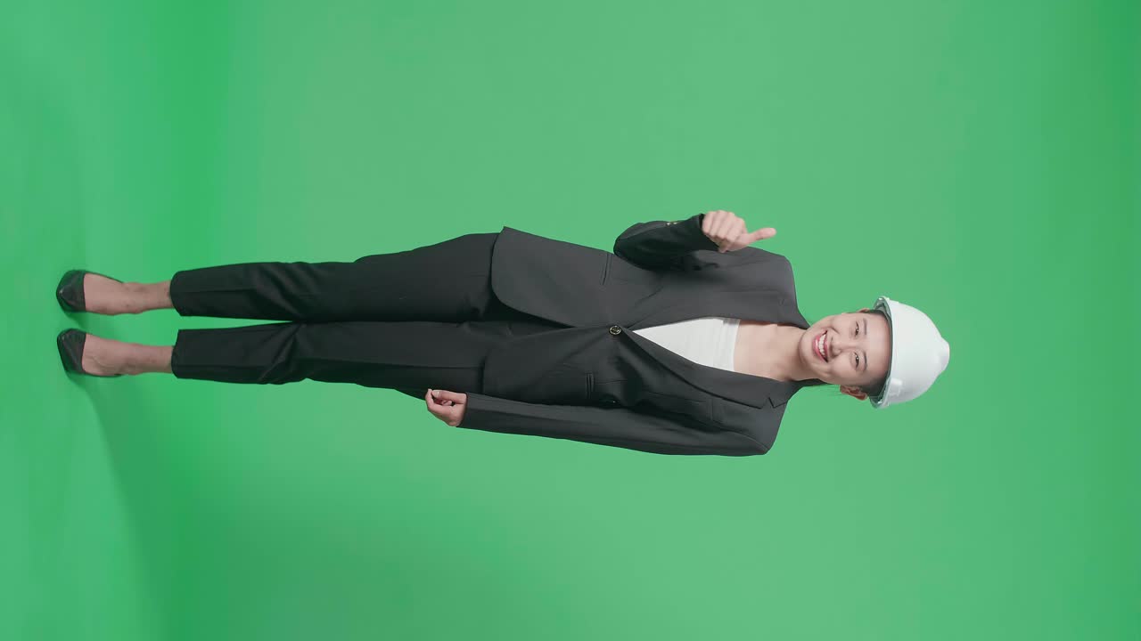 Businesswoman Engineer in a Suit with Thumbs Up