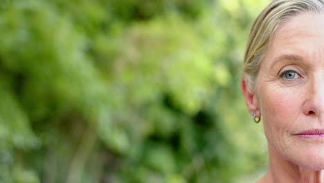 Close-up-of-a-senior-Caucasian-woman-outdoors,-with-copy-space