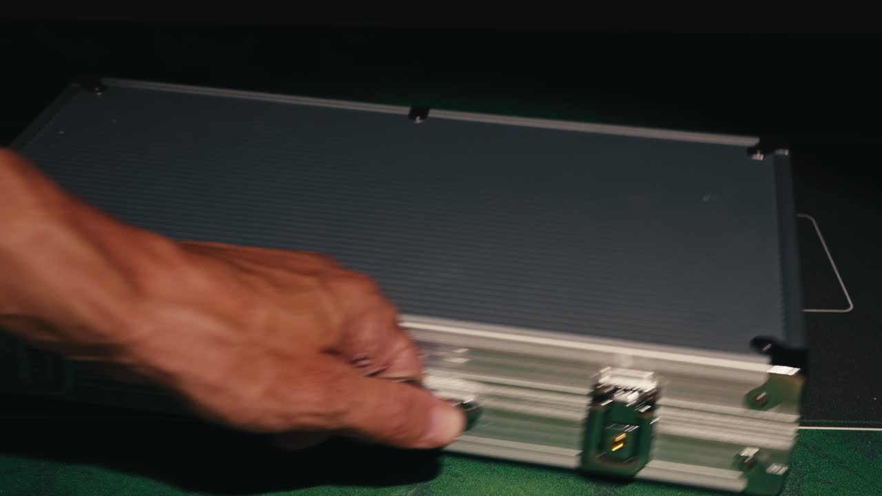 Hands managing poker chips on green table, reflecting intense poker gameplay with the element of chance and skill