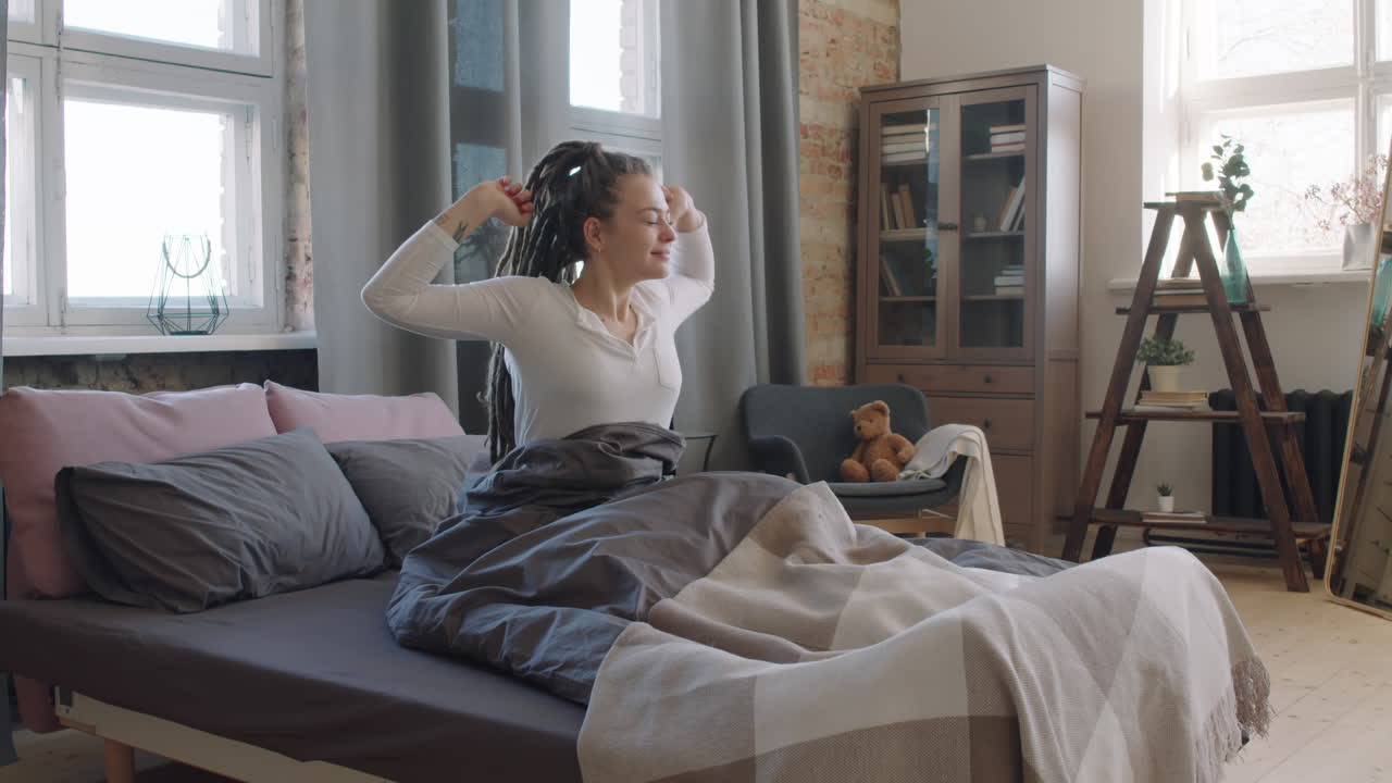 Pretty Woman Stretching In Bed In Morning