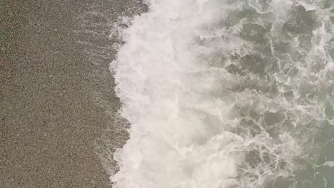 Sea-water-waves-pounding-the-sand-at-the-shore