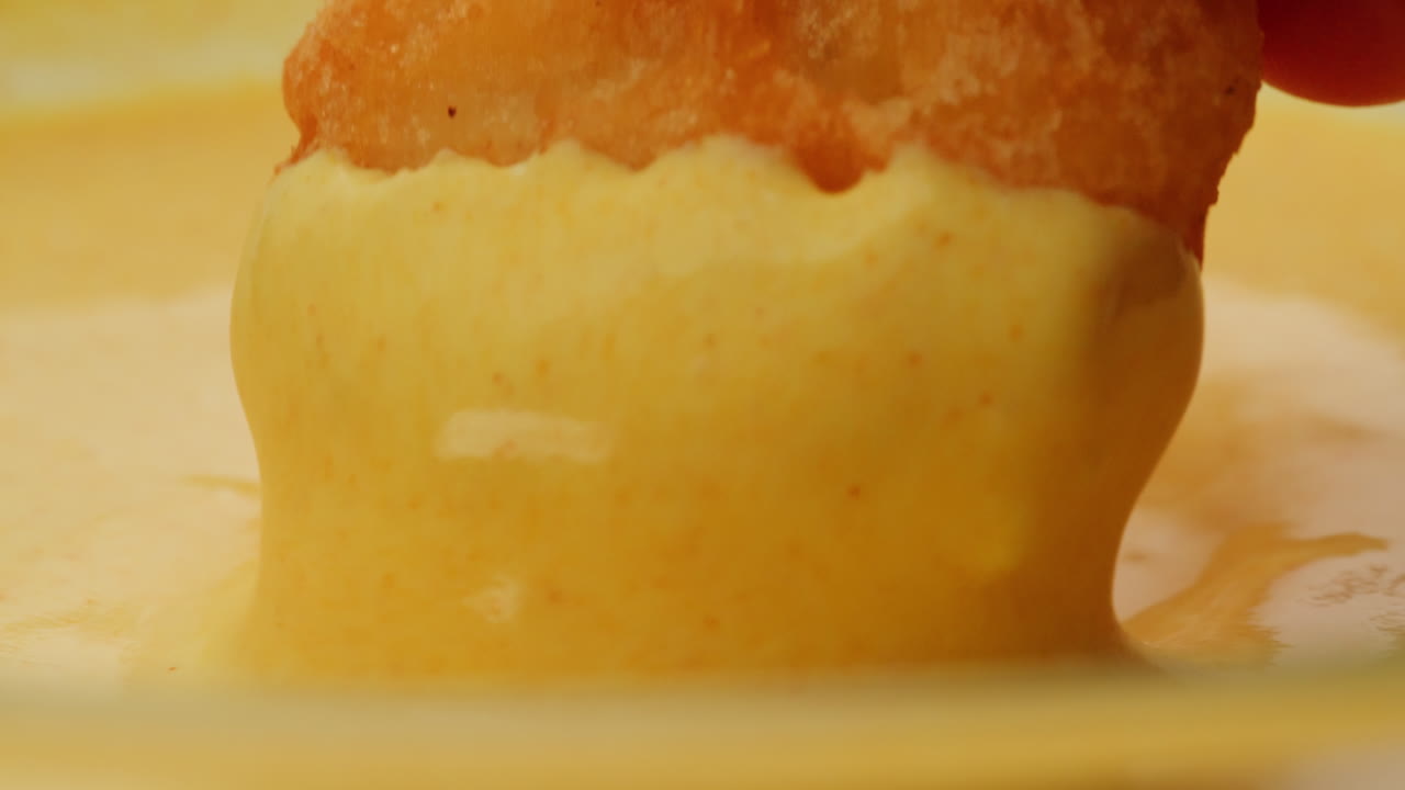 Dipping Chicken Nuggets in Sauce