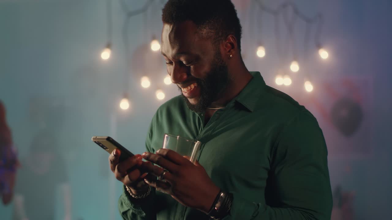 Happy Man Texting and Drinking