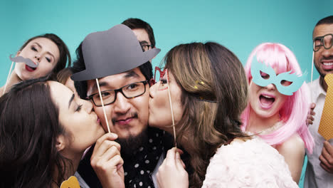 multi racial group of funny people celebrating slow motion party photo booth