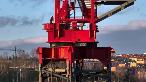 Aerial-view-of-rusty-crane-arm,-drone-shot