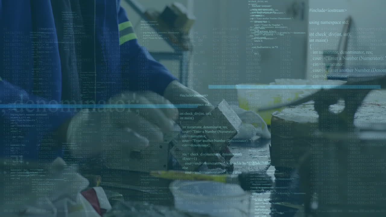 Animation of computer language over midsection of worker greasing mold in factory