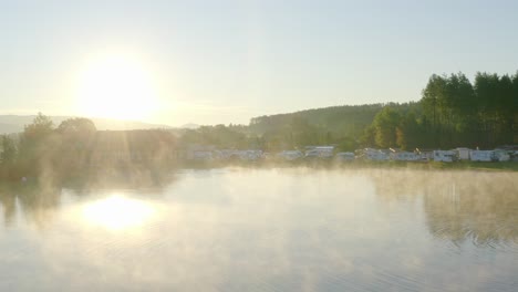 Magical-view-showing-lake-during-misty-morning-at-Pirkdorfer-see-campsite,-Austria