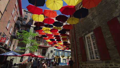 rue du cul de sac decorated with colorful umbrellas