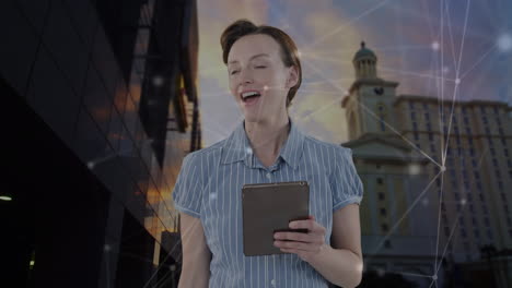 animation of caucasian businesswoman using tablet and network of connections over cityscape