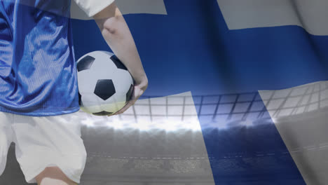 Soccer-player-and-Finnish-flag-against-stadium