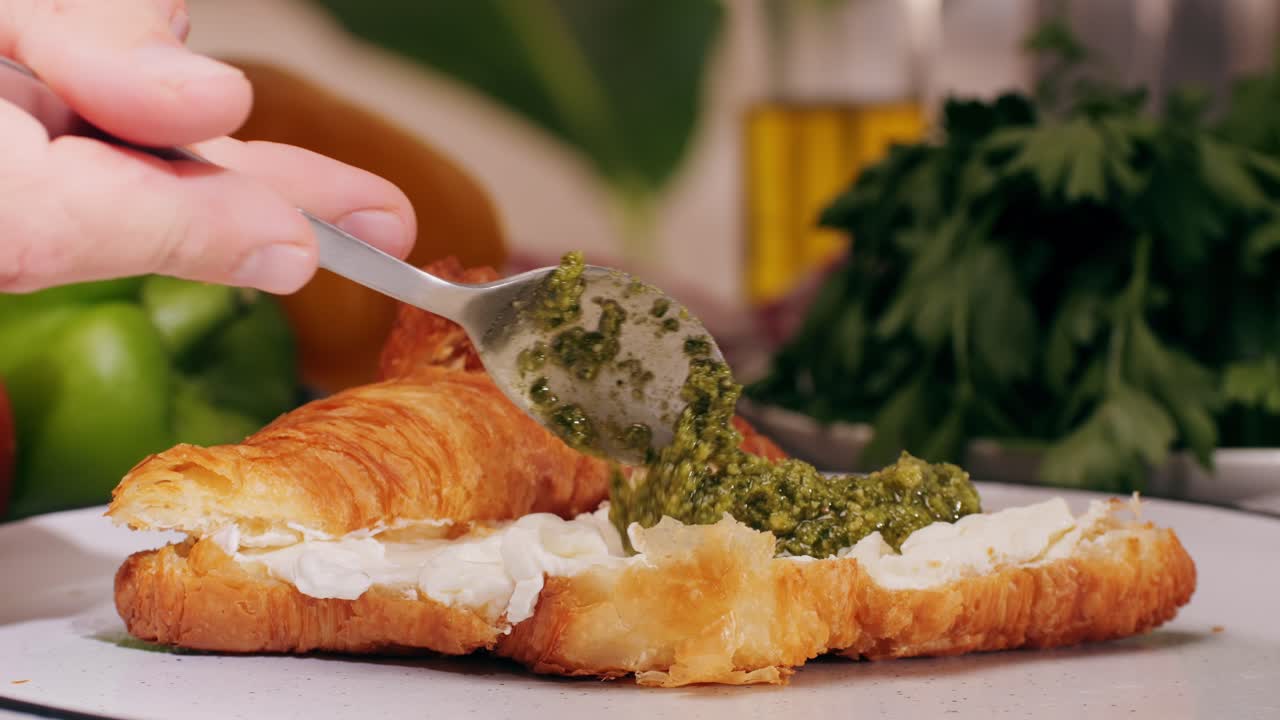 Croissant with jamon ham, Salmon, in Modern Cafe, Top View of Healthy Breakfast in Cafe. English breakfast: fried egg, bacon toast on sandwich.