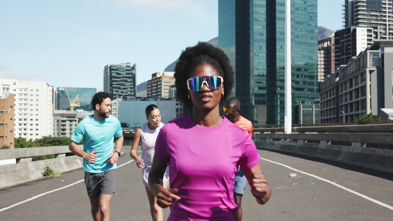 Group of Diverse People Running on an Urban City Bridge