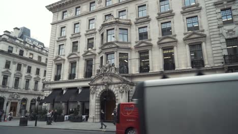 london city street scene with double decker bus and buildings