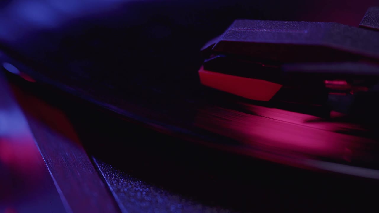 Retro Turntable Playing Vinyl Record with Vibrant Pink and Blue Neon Lights