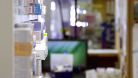 pharmacist holding prescription while checking medicine