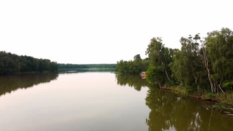 Small-boat-floating-on-a-lake-in-Brandenburg,-Germany