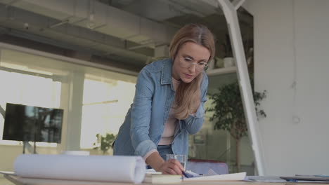 international women's day. business mature female working in the office.