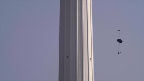 base jumpers jumping from menara tower in kuala lumpur.