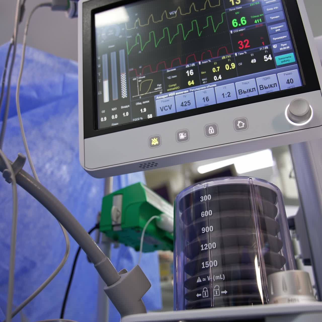 Artificial lung ventilation machine working in surgery room. Screens with patient's life parameters are above. Low angle view