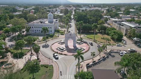 arc of triumph and city hall at san juan de la maguana with urbanscape in background, dominican republic