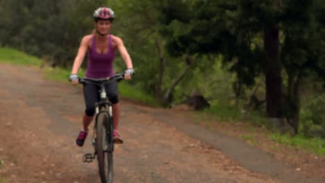 Couple-biking-through-a-forest