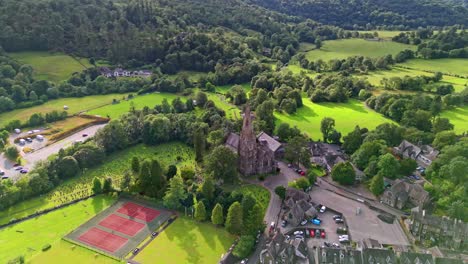 Aerial-footage-of-Ambleside-town-and-chrch,-now-in-the-parish-of-Lakes,-in-Cumbria,-in-North-West-England