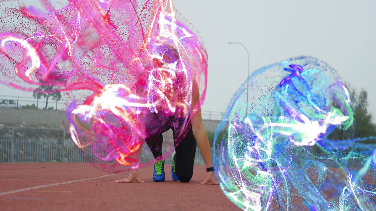 Atleta ajoelhado em pista vermelha, com esferas cintilantes rosa e verde-água girando ao redor do tronco para tecnologia fitness