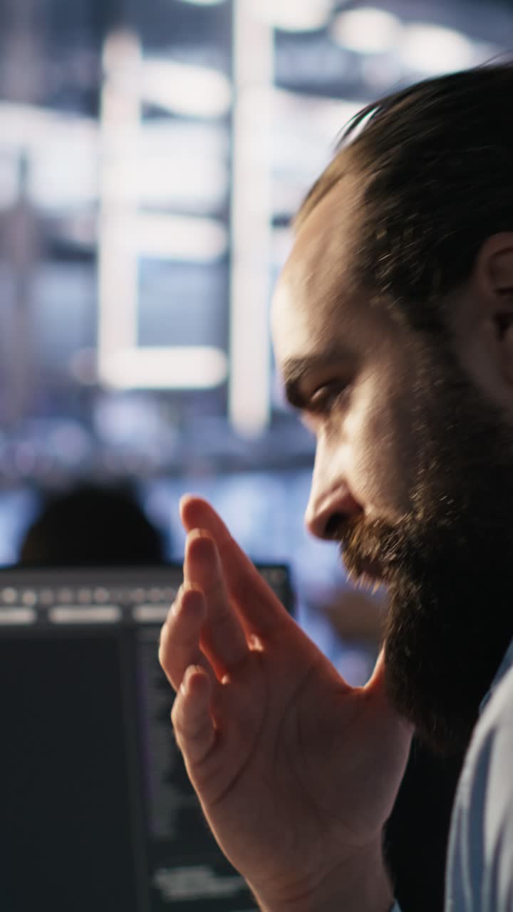 Vertical video Exhausted computer scientist in server room suffering from mental fatigue