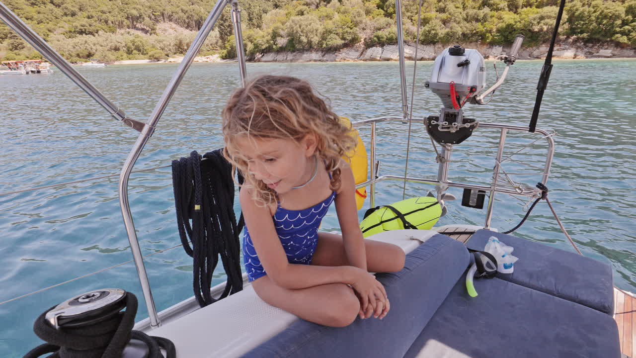small girl enjoying a yacht in greece