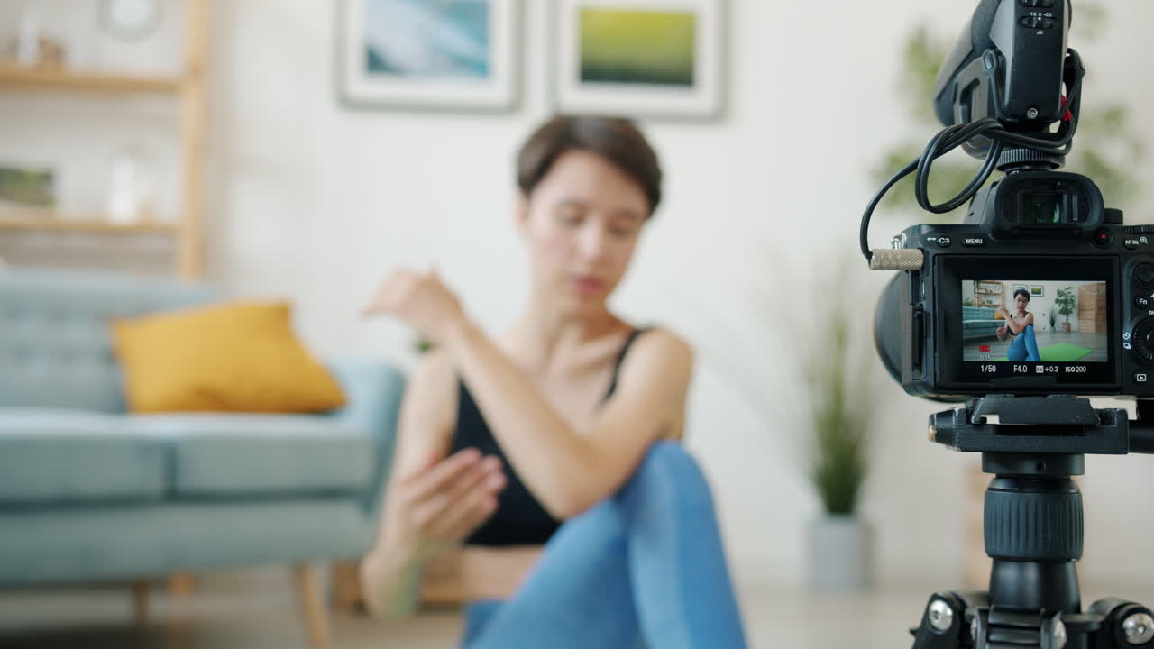 Woman teaching yoga online