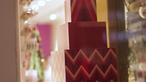 stacked christmas gift boxes in storefront display