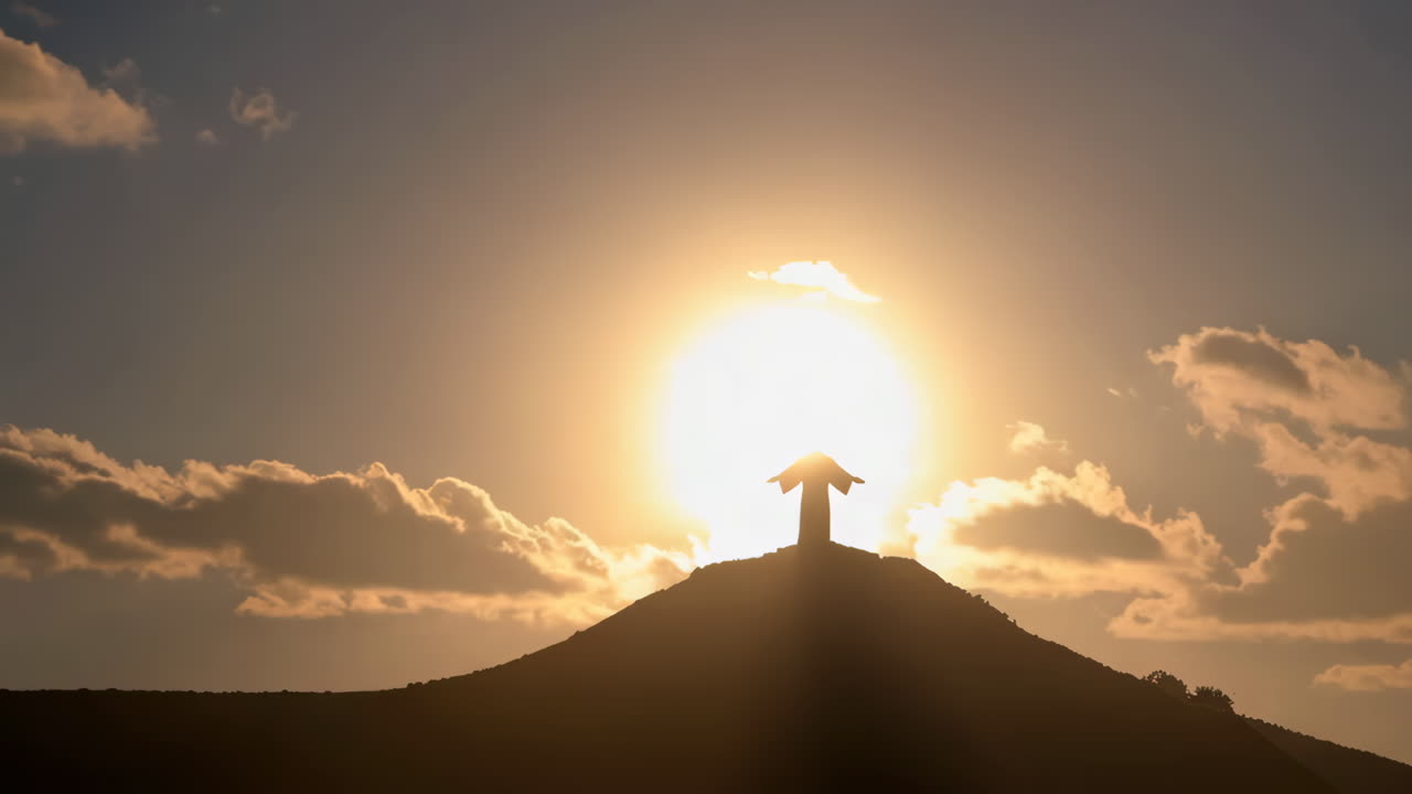 Jesus Silhouette on Mountain at Sunset